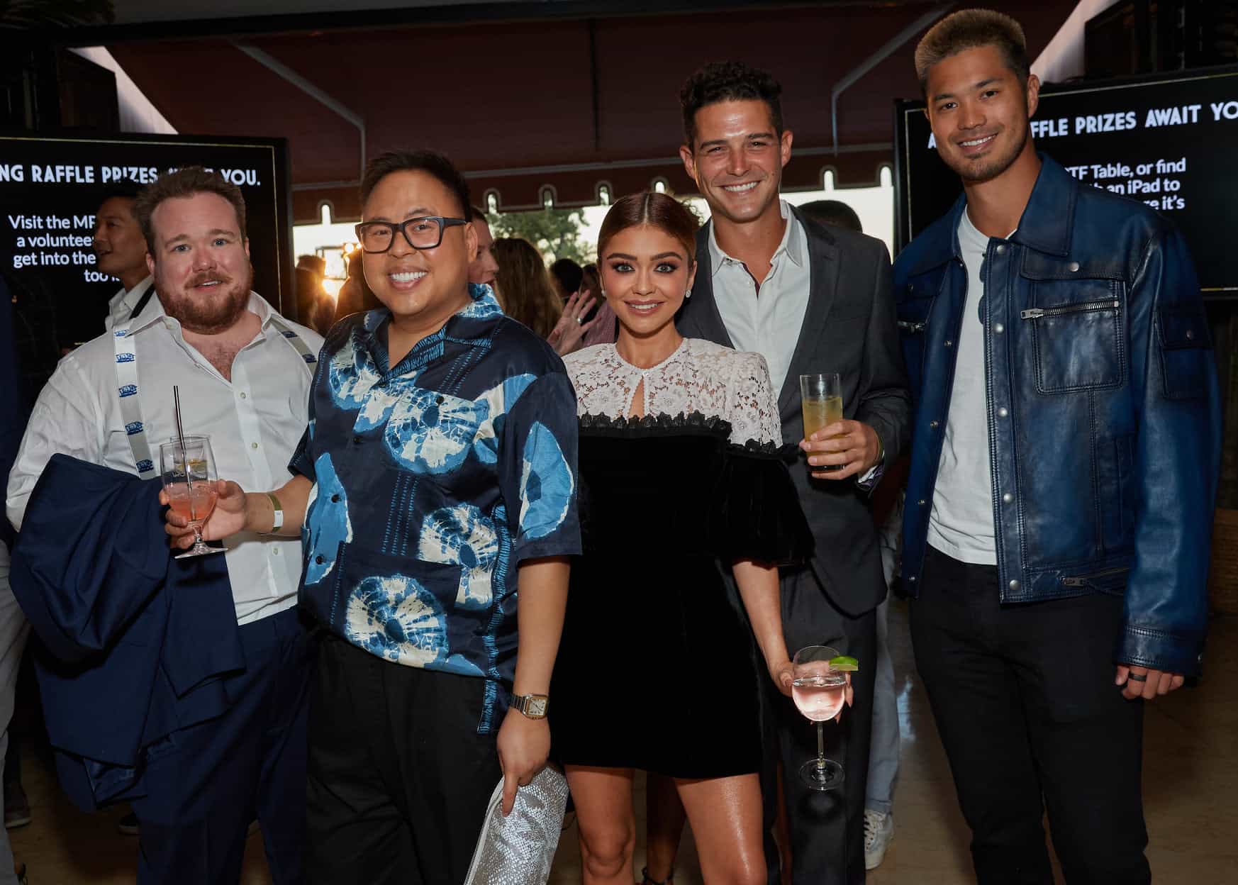 A group of people posing for a picture at an event.