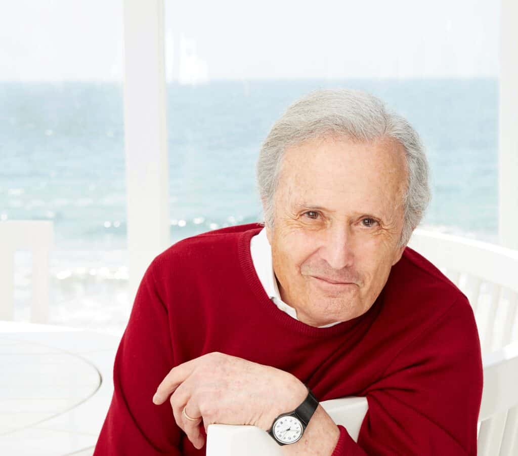 A man wearing a red sweater.